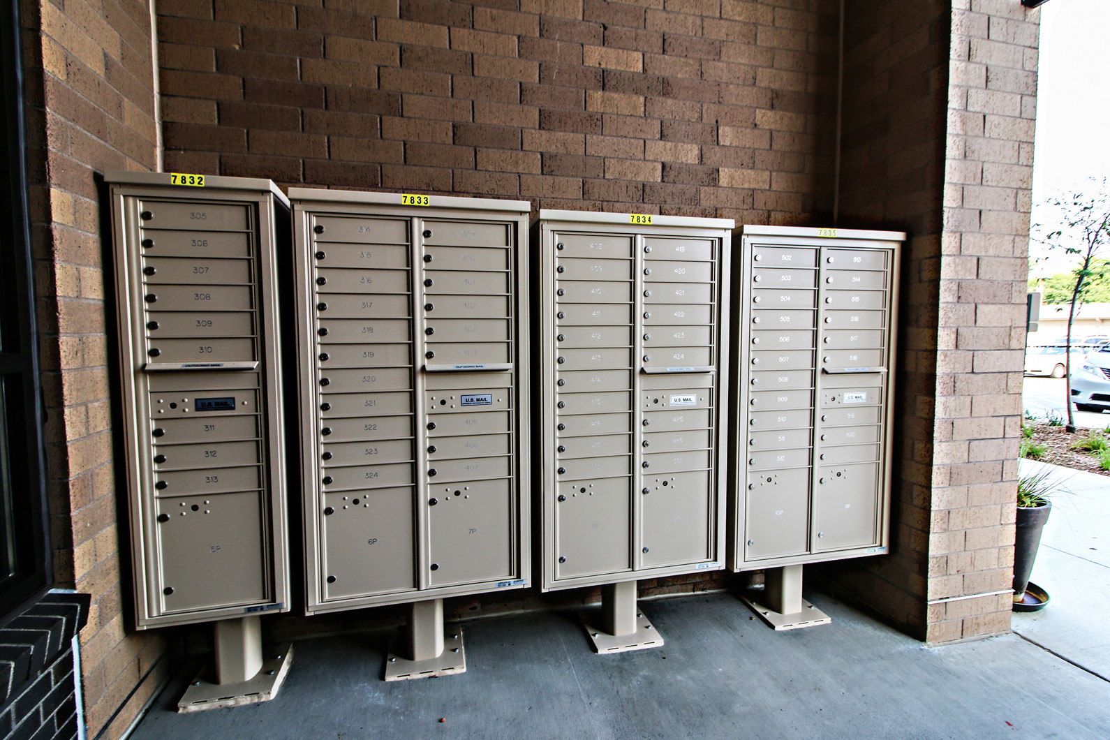 a row of mailboxes on the side of a building