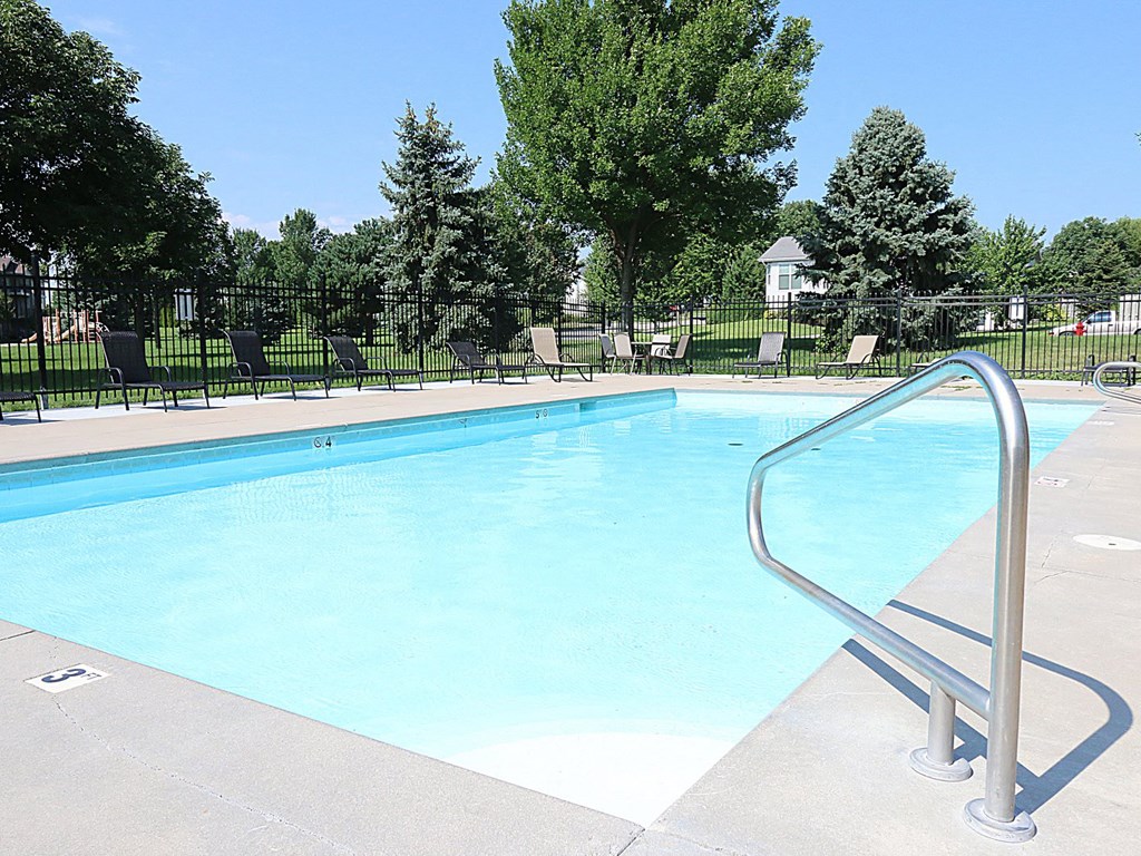 a swimming pool with a fence around it