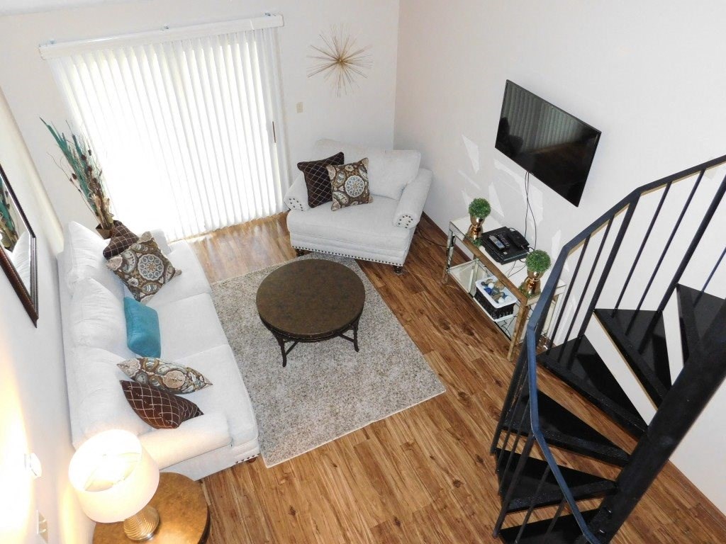 an overhead view of a living room with a couch and a table