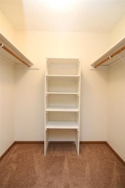 a white closet with empty shelves in it