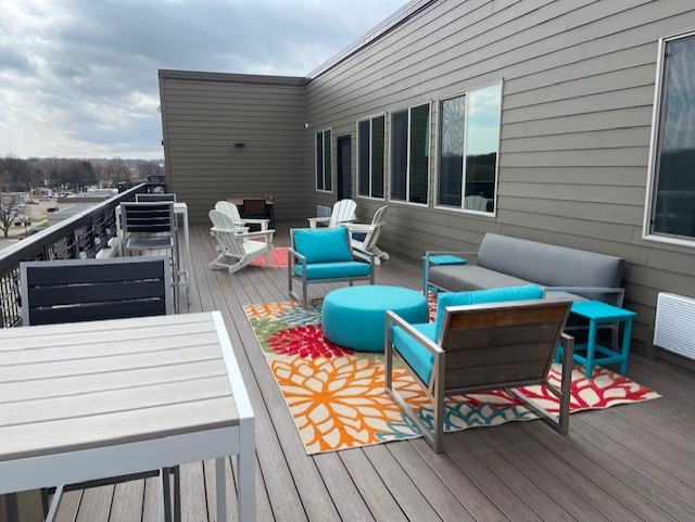 a large patio with furniture on top of a building