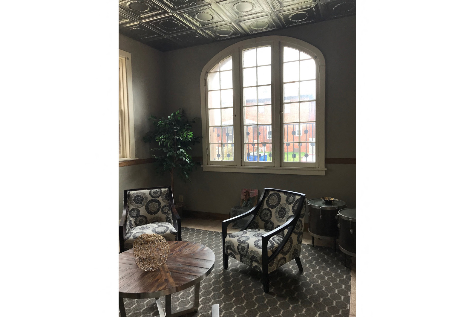 a seating area with chairs and a table