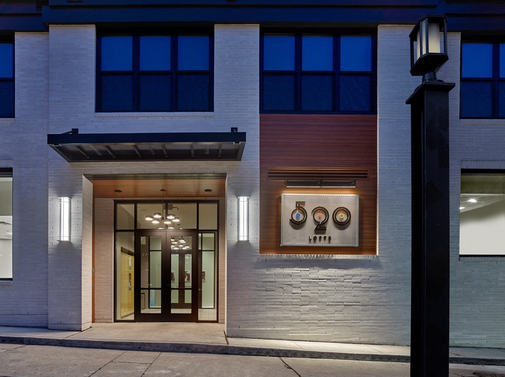 the front of a building at night with a glass door at 520 Lofts, Allentown, PA