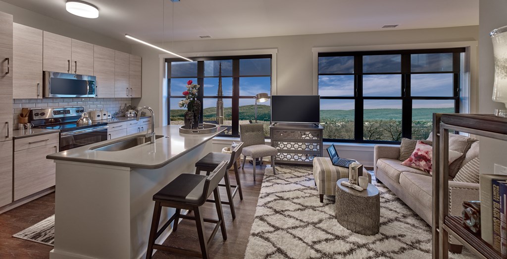a kitchen and living room with a view of the city at 520 Lofts, Allentown, 18101