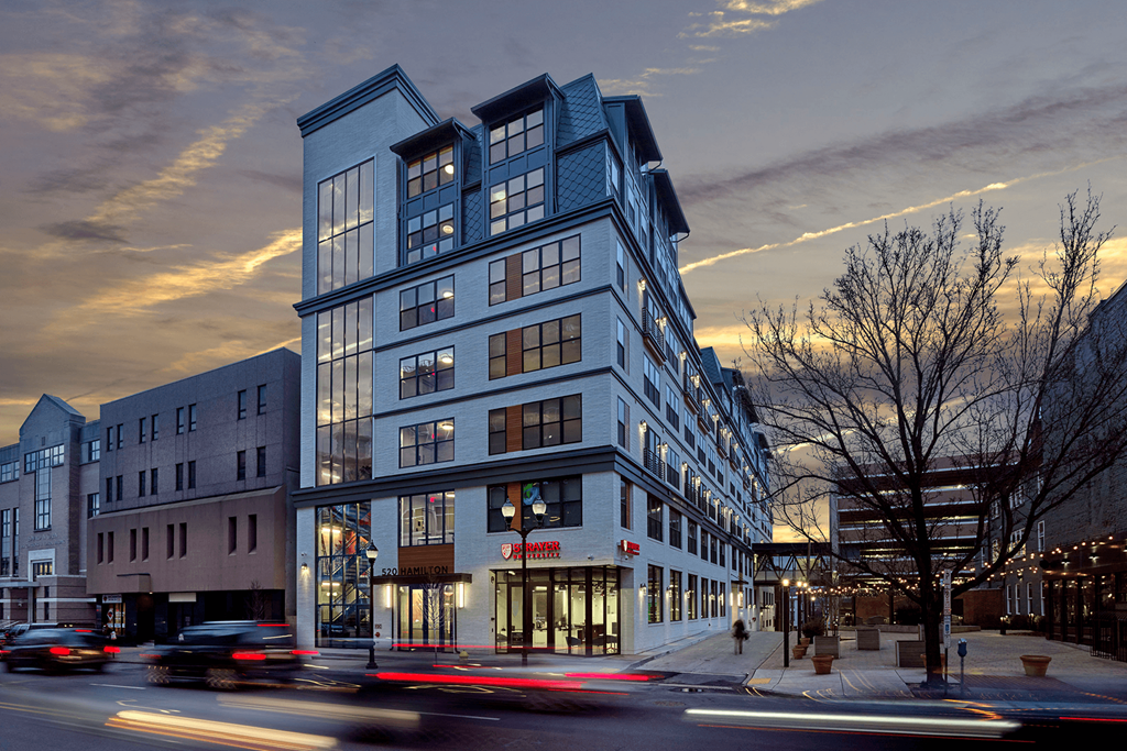 an evening view of a blue building on a city street at 520 Lofts, Allentown, PA