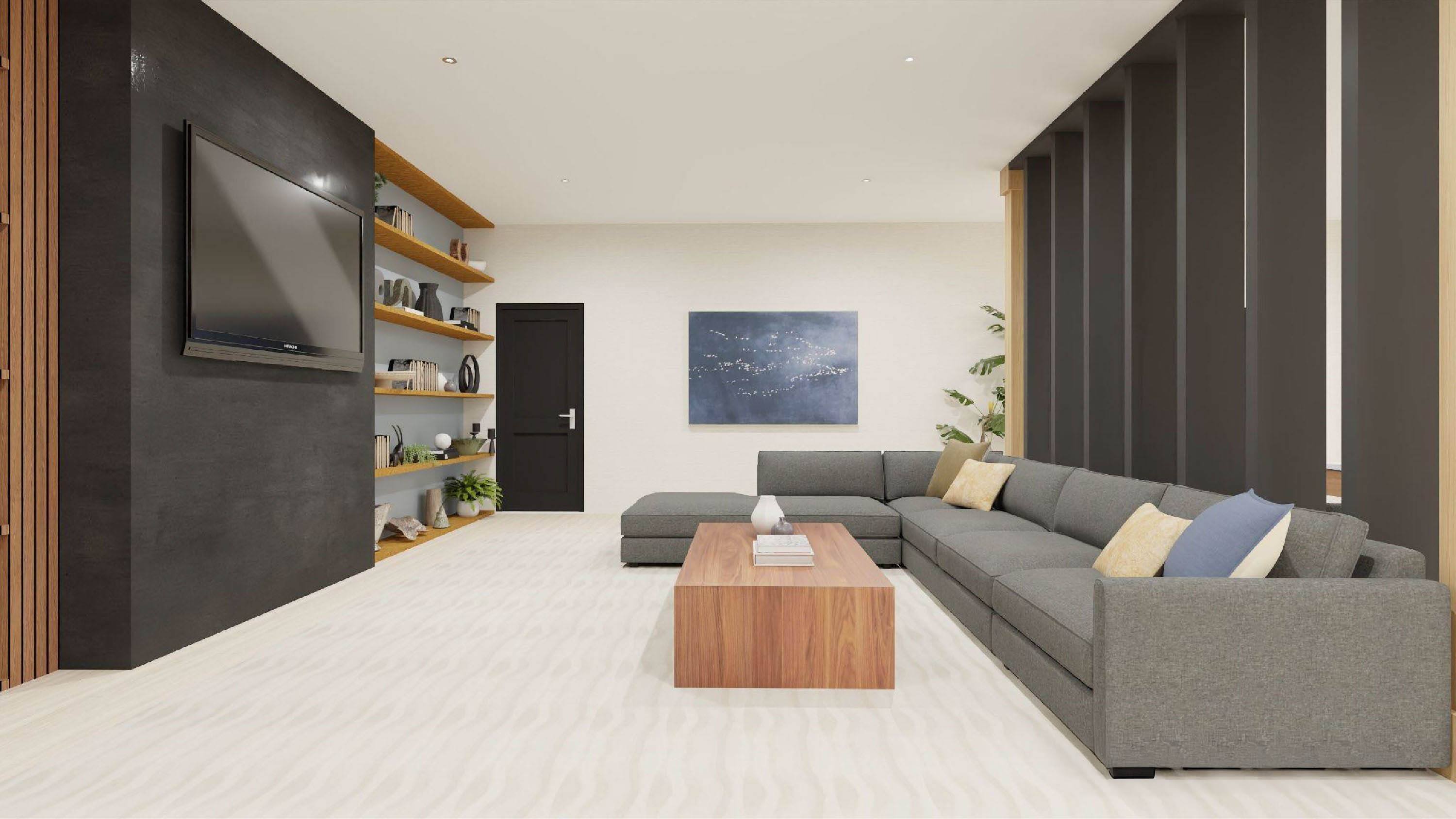 A modern living room with a grey sofa and a wooden coffee table.