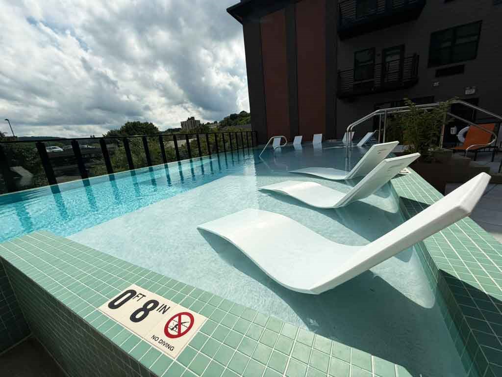 A pool with a sign that says 0'8" no diving.