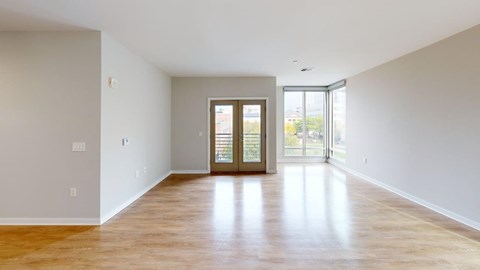 A room with wooden floors and white walls.