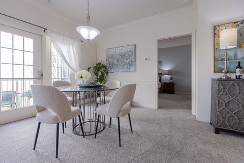 Bright dining room with a glass table at Saucon View Apartments, Bethlehem, PA