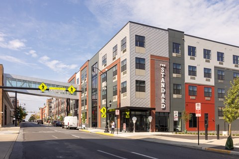 A street view of a building with the word "Standard" on it.