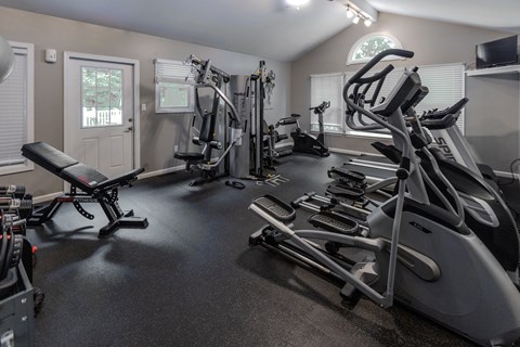 A gym with treadmills, elliptical machines, and other exercise equipment. at Meadows Apartments, Pennsylvania, 18049