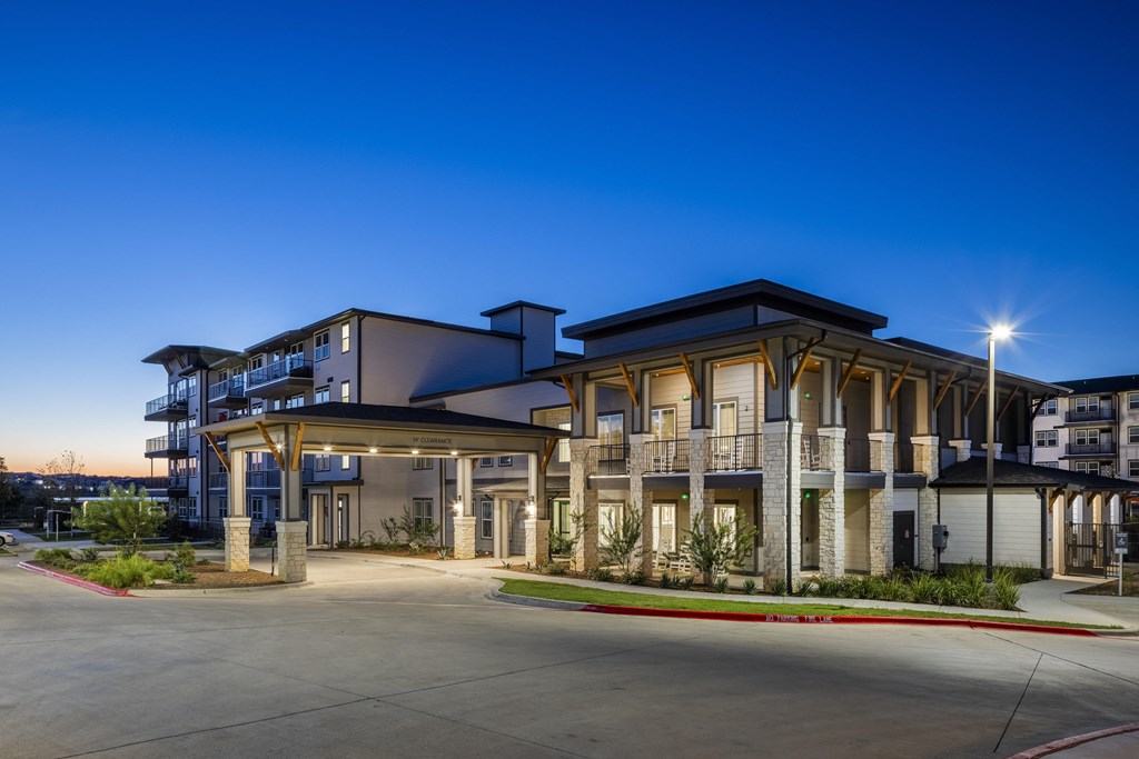 a building with a street in front of it at night