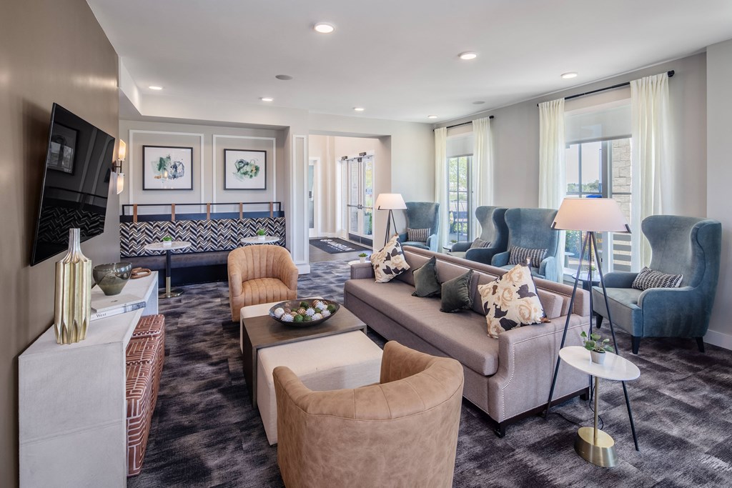 a living room with couches and chairs