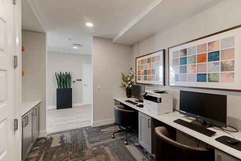 A home office with a desk, chair, and computer.