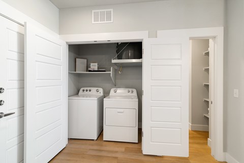 A laundry room with a washer and dryer.