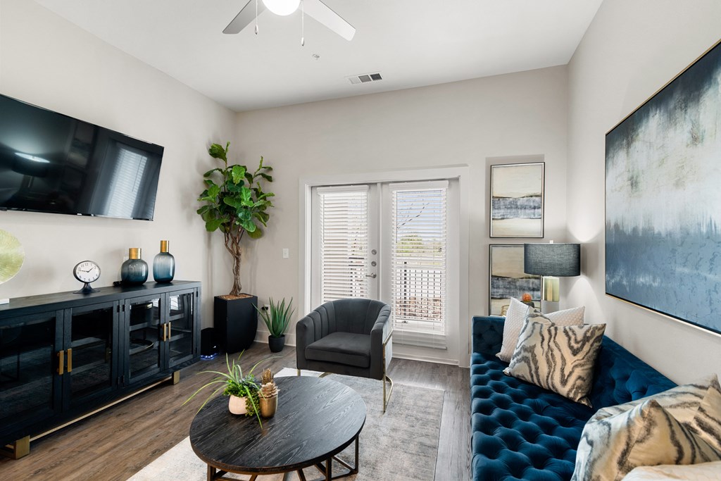 a living room with a couch and a table and a tv