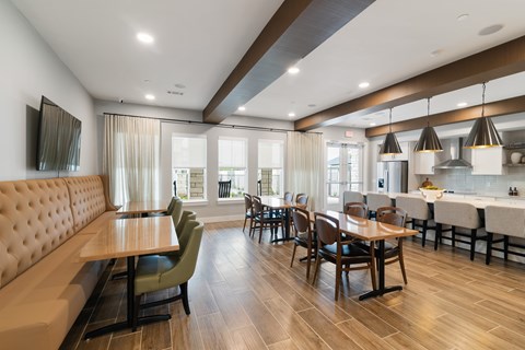 A modern dining room with a wooden table and chairs.