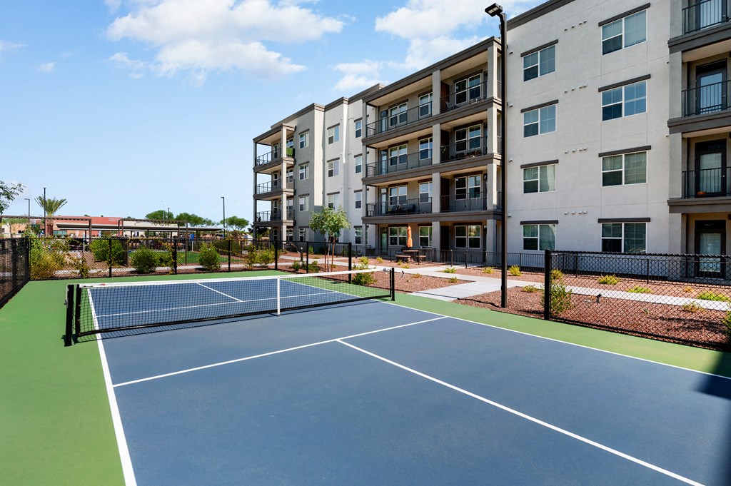 tennis court at the falls at rolland park apartments