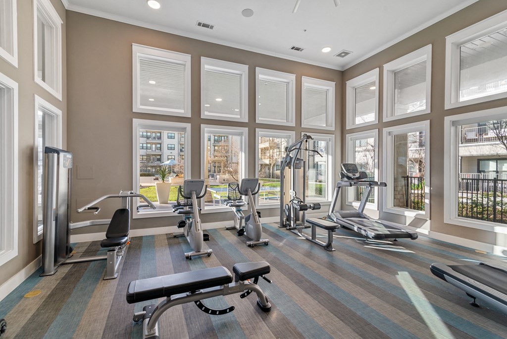 the gym at the district flats apartments in lenexa