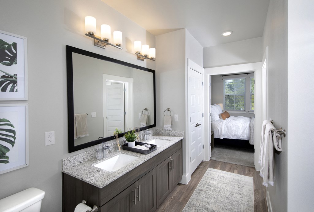 a bathroom with two sinks at a senior apartment community