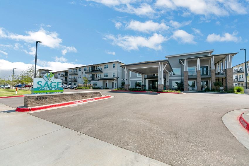 a large building with a sign that says sage in front of it