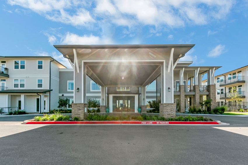 a view of the front of the hotel from the parking lot