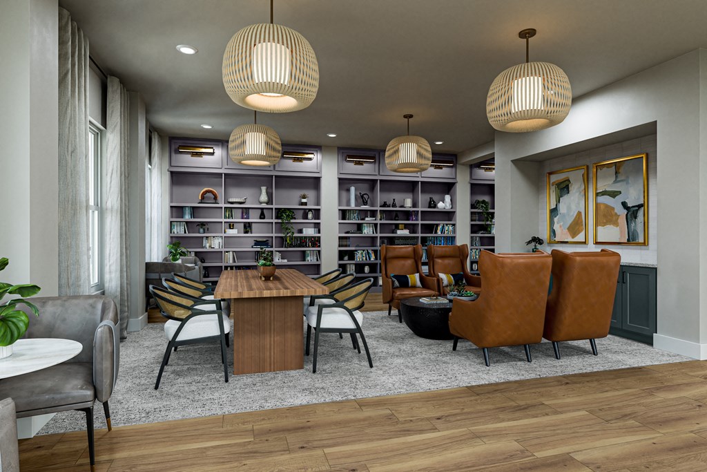 a library with sitting areas at a senior apartment community