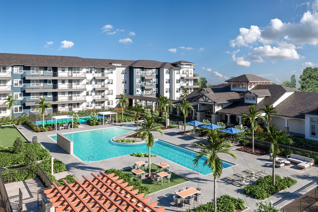 an aerial view of the resort style pool at the enclave at woodbridge apartments in sugar land