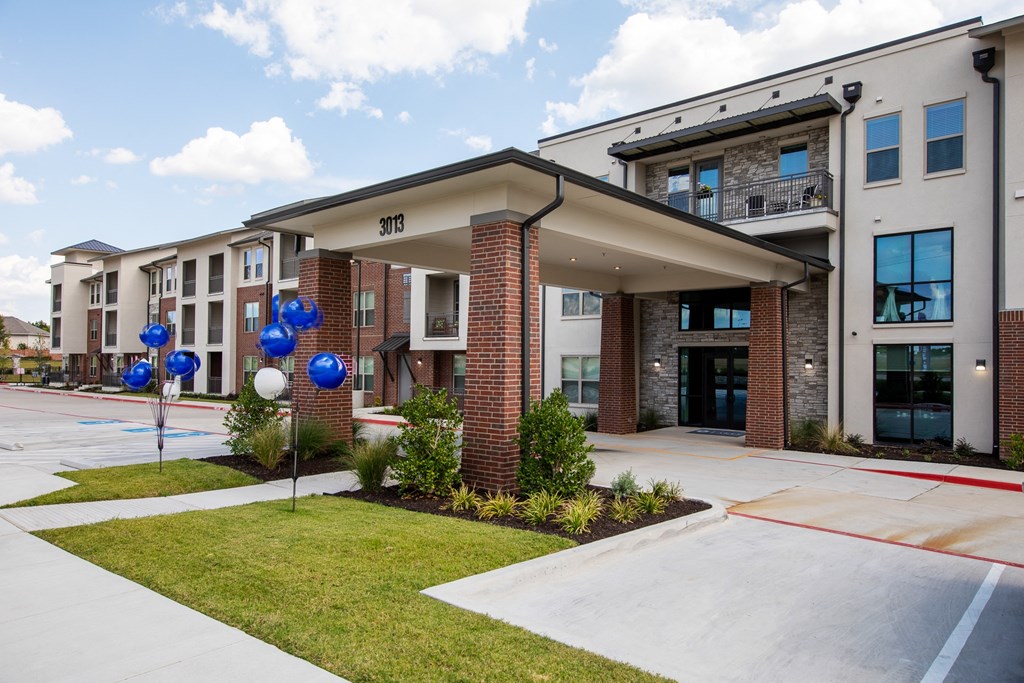 an outside view of the entrance to a senior apartment community