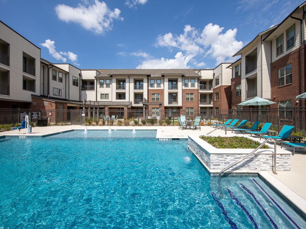 a resort-style swimming pool at a senior apartment community