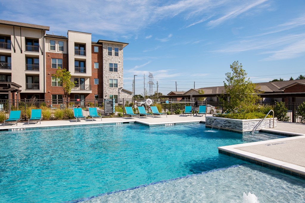 our apartments have a large swimming pool with lounge chairs