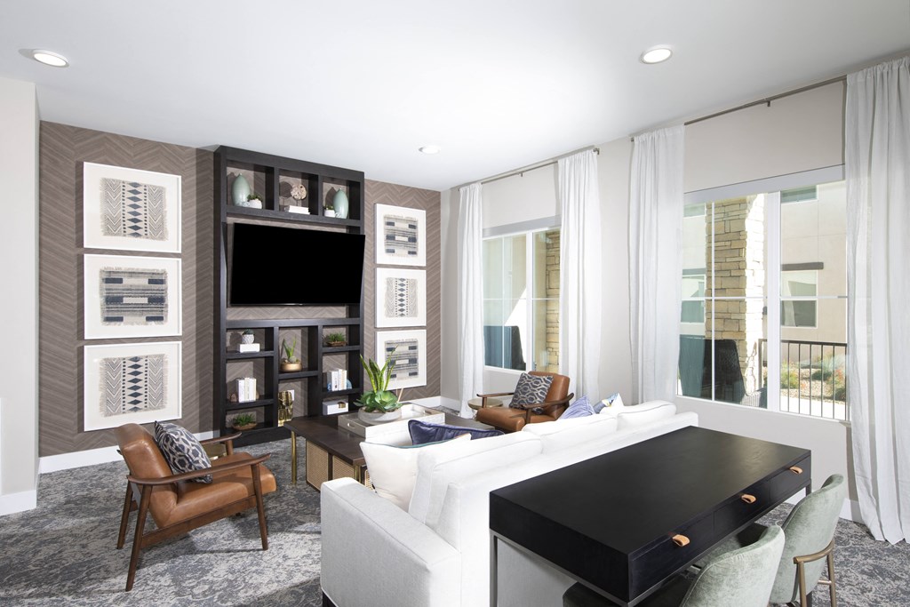 a living room with a white couch and a black table