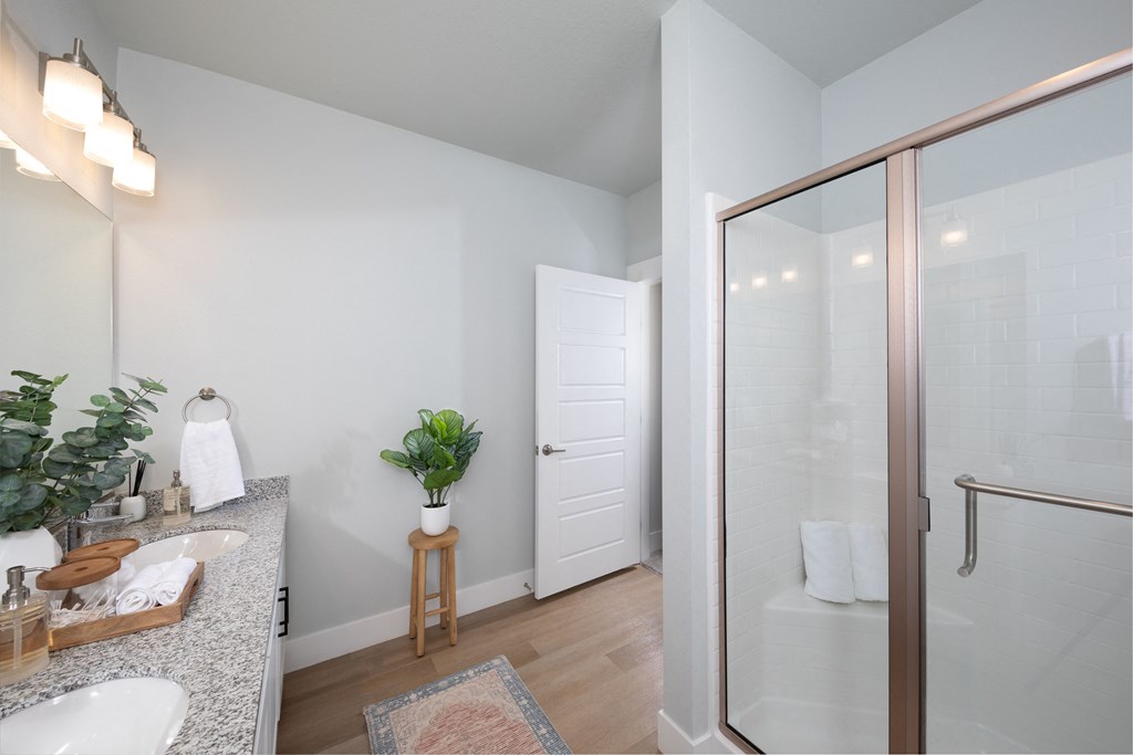 a bathroom with a shower at a senior apartment community