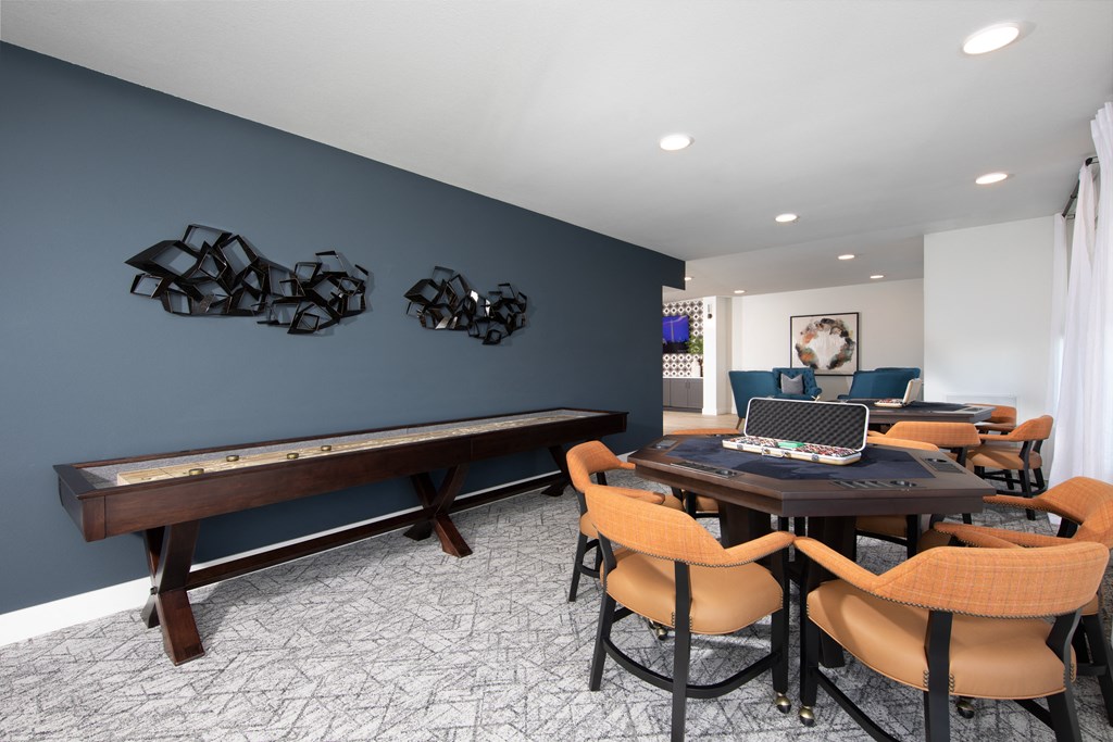a game room with a ping pong table and a pool table