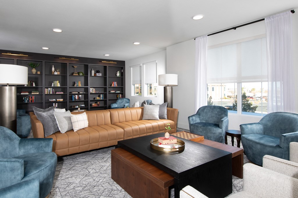 a living room with a leather couch and a coffee table