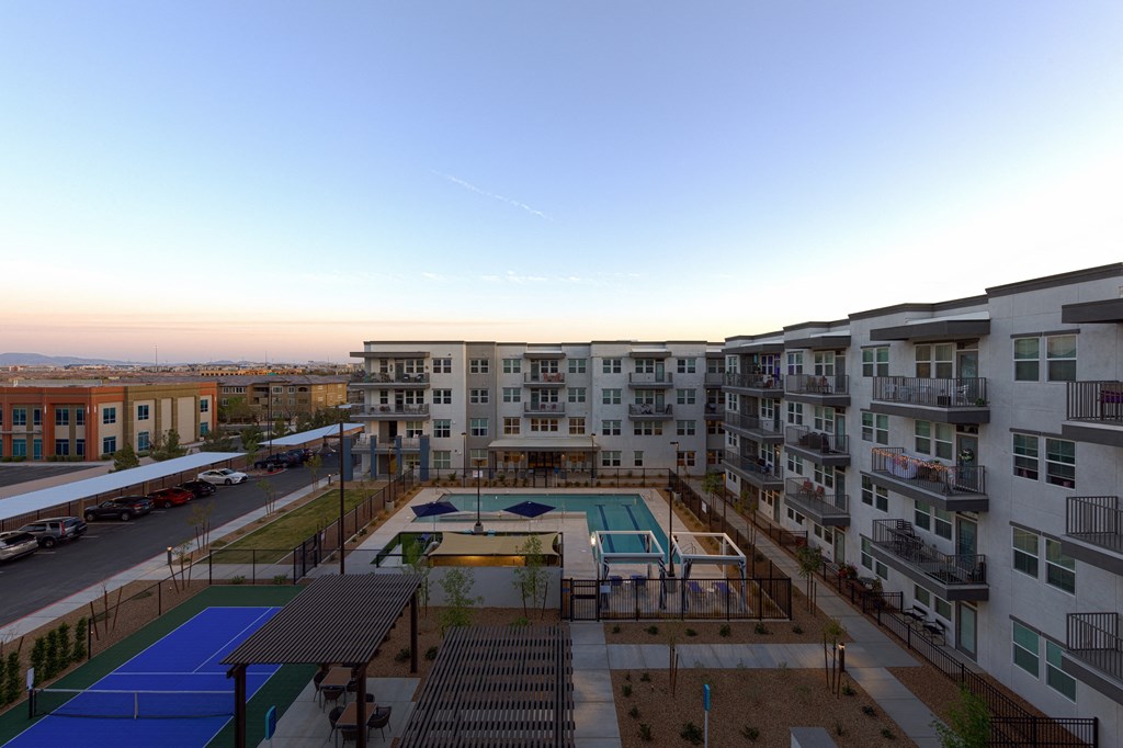 an aerial view of an apartment building with a pool