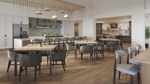 A modern kitchen with a dining table and chairs.