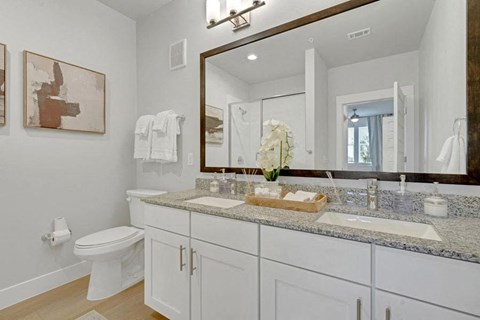a bathroom with a double sink at a senior apartment community