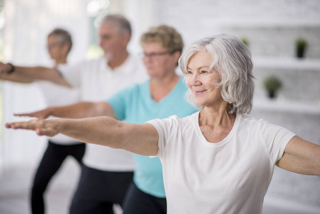 older women in a yoga class at a senior apartment community