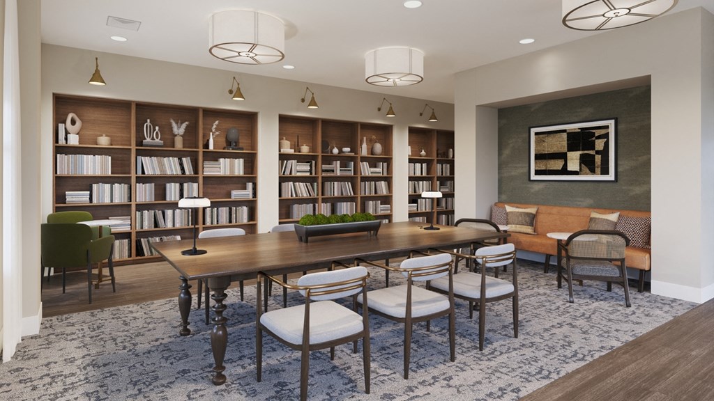 a conference room with a table and chairs and a library
