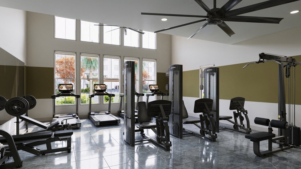 a gym with weights and a ceiling fan