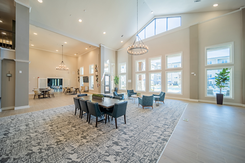 a communal clubhouse lounge area at a senior apartment community