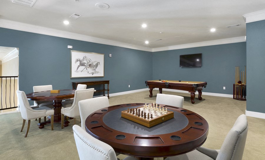 a game room with a pool table and a chess board