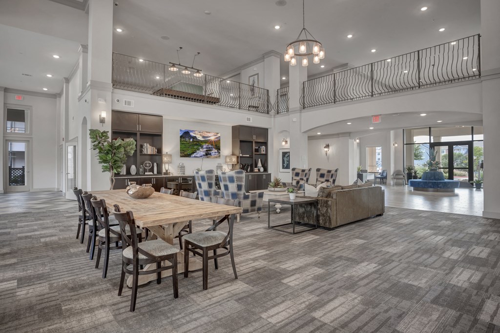an open living room and dining room with a table and chairs