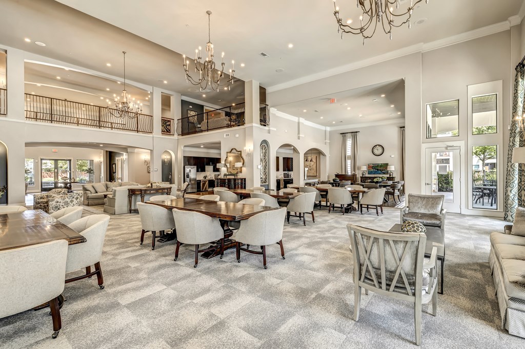 a large dining room with tables and chairs
