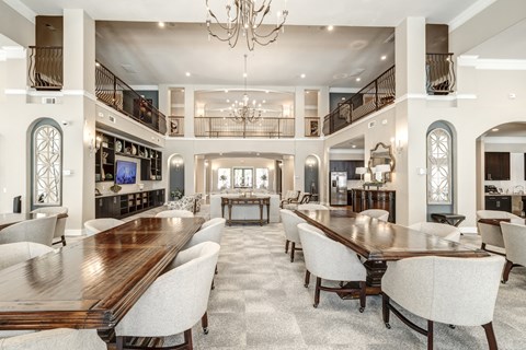 a large lobby with chandeliers and dining