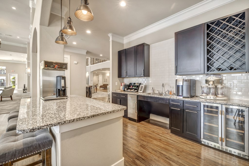 a kitchen with a marble counter top and a sink