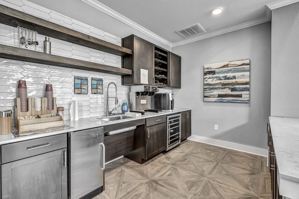 a kitchen with stainless steel appliances and wooden cabinets