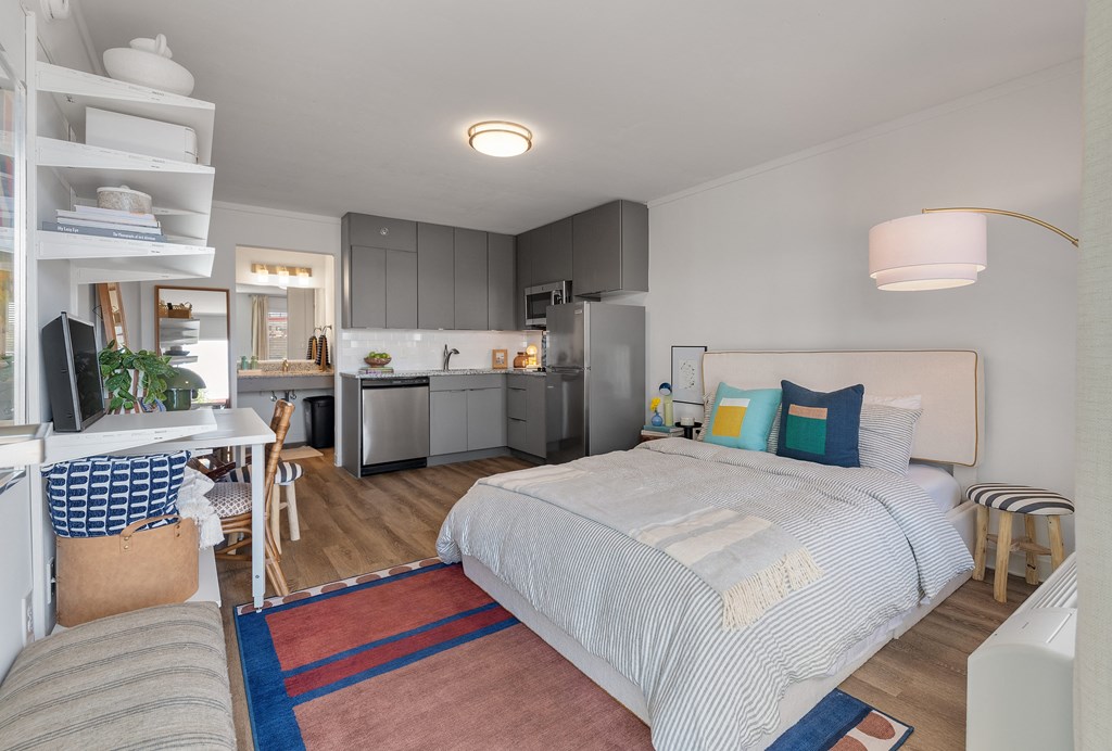 studio apartment bed desk and kitchen at The Teale Navy Yard, North Charleston, South Carolina