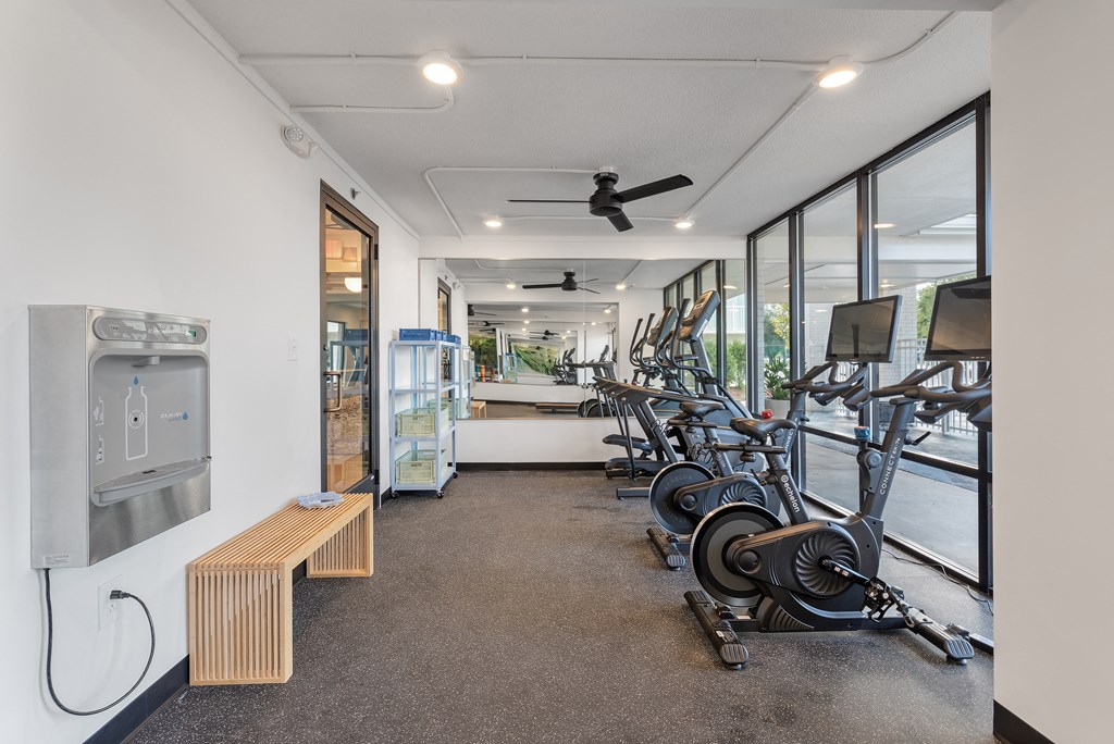 a gym with weights and cardio machines and a water fountain at The Teale Navy Yard, North Charleston, South Carolina